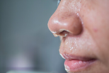 close up of a person with a drop of sweat on his face