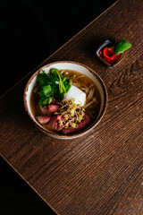 vietnamese national pho soup on a wooden table
