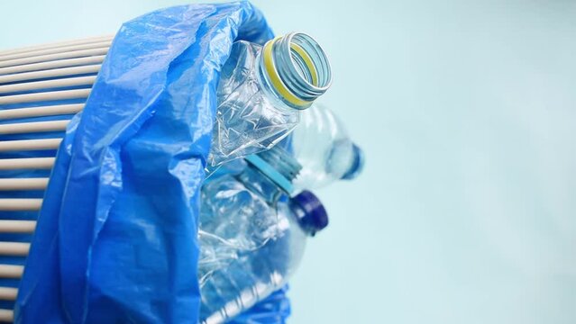 Vertical video of  man leaving a plastic bottle in recycling bin