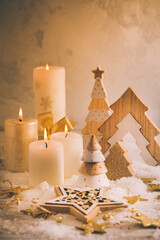 Christmas decoration with candles and wooden Christmas trees
