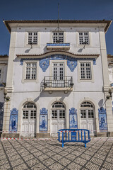 External view of Historic building of old Aveiro Railway station ornamented with typical blue azulejos tile exterior, which tells a story of life in traditional Portugal. Aveiro, Portugal.