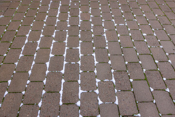 Fototapeta premium View of paving from paving slabs near house on winter day. Sweden.