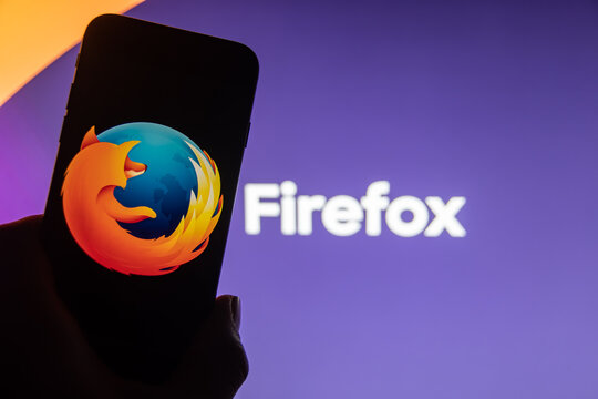 Rheinbach, Germany  21 November 2022,  The brand logo of the web browser "Mozilla Firefox" on the display of a smartphone (focus on the brand logo)
