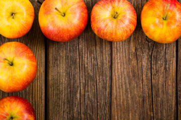 apple fruits frame background, old weathered wood table