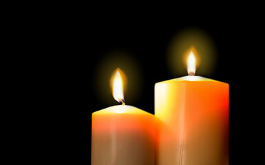 lighting a candle with a match in the dark. Copy space