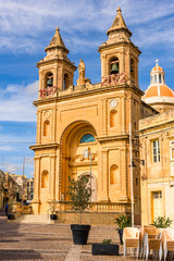 Fototapeta na wymiar Marsaxlokk fishing village in Malta and Sanctuary of Our Lady of Pompei parish church