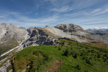 wide view of an alpine valley among the Dolomites in Val Gardena (Puez group in the background)