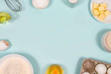 Ingredients for cookies - flour, sugar, egg, butter. Background with baking ingredients. Copy space.