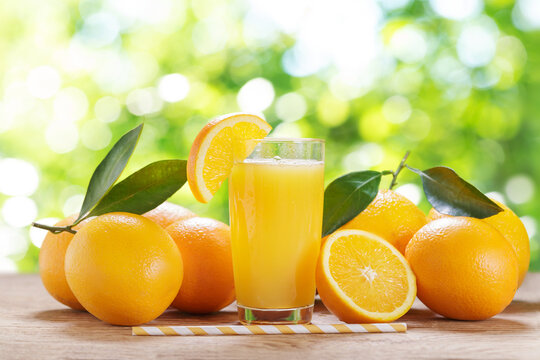 glass of fresh orange juice with fresh fruits