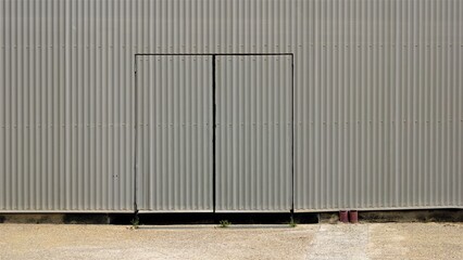 gray corrugated metal door on facade