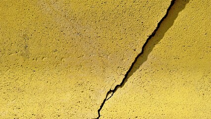 crack in yellow concrete structure background