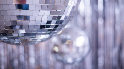 Silver background with disco ball. Selective focus