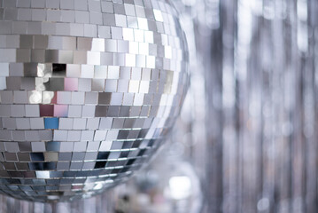 Silver background with disco ball. Selective focus