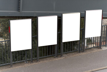 diagonally offset billboard in the city on a steep street	