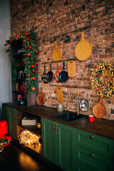 Christmas bright stylish Scandinavian style kitchen. The concept of a decorated cozy home for the holidays.