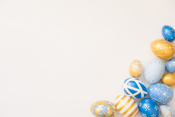 Frame of Easter decorated eggs isolated on white background. Minimal easter concept. Happy Easter card with copy space for text. Top view, flatlay.