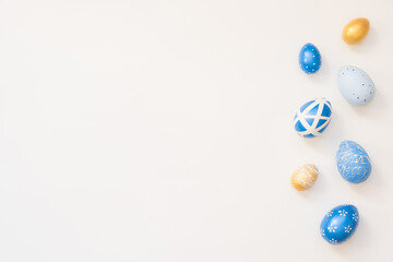 Frame of Easter decorated eggs isolated on white background. Minimal easter concept. Happy Easter card with copy space for text. Top view, flatlay.