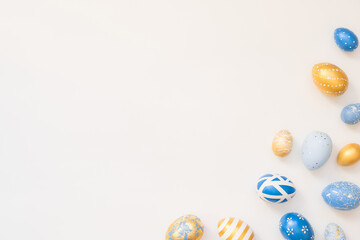 Frame of Easter decorated eggs isolated on white background. Minimal easter concept. Happy Easter card with copy space for text. Top view, flatlay.