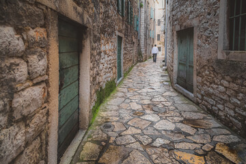 Fototapeta premium An old cobbelstone lane in the historic Sibenik Old Town, Croatia.