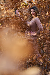 Size plus woman in a forest in the autumn