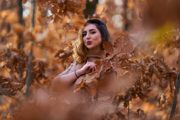 Size plus woman in a forest in the autumn