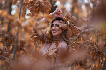 Size plus woman in a forest in the autumn
