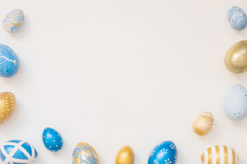 Blue Easter decorated eggs isolated on white background. Minimal easter concept. Happy Easter card with copy space for text. Top view, flatlay.