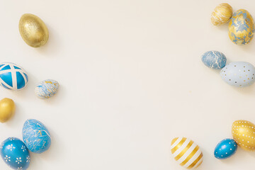 Obraz na płótnie Canvas Blue Easter decorated eggs isolated on white background. Minimal easter concept. Happy Easter card with copy space for text. Top view, flatlay.