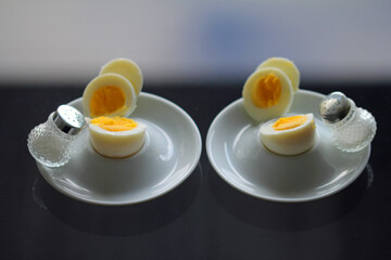 a pair of eggs on the Smoke glass table
