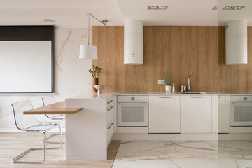 Elegant kitchen with mirror open to room with screen
