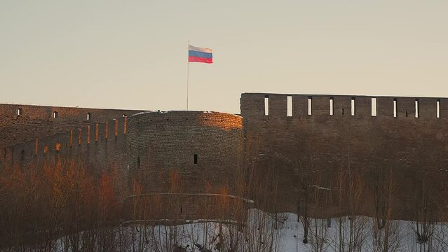 Ivangorod, Russia - 03.12.2021: the old fortress and the Russian flag.