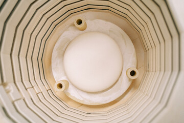 Ceramic kiln top view from above. Firing clay. Clay in ceramic kiln.