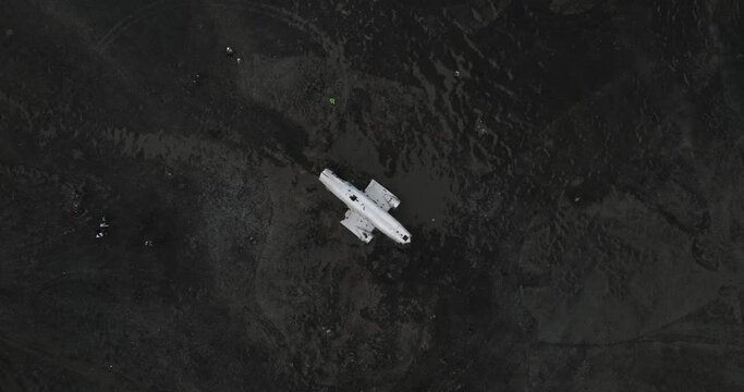 aerial shot of dc 3 plane wreck in iceland black beach