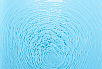 Background with water, waves on the water in the pool during the day, cosmetic moisturizer emulsion