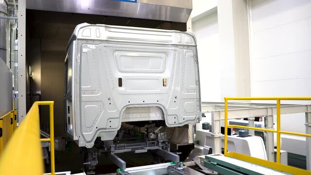 Large truck cab. Scene. Preparation of the truck body for painting in a different color. 