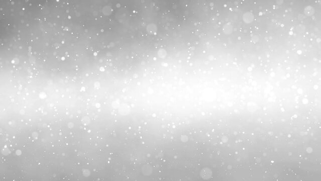 Looped fast falling snowflakes on silver white snowy background