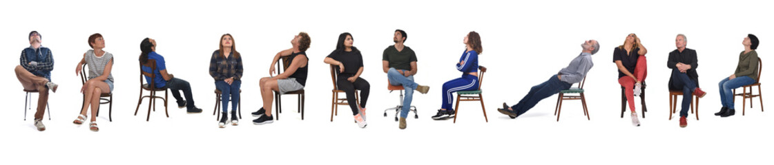 large group of people sitting on chair and looking up on white background