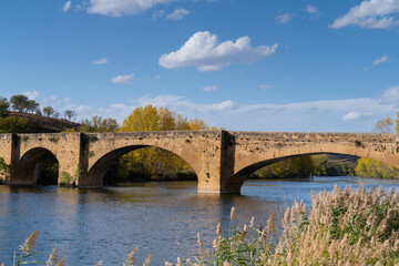 Fototapeta na wymiar Medieval bridge over River Ebro San Vicente de la Sonsierra village in La Rioja Province, Spain