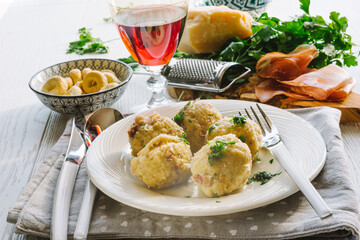 Speck dumplings cooked in vegetable broth. Typical Tyrolean dish.