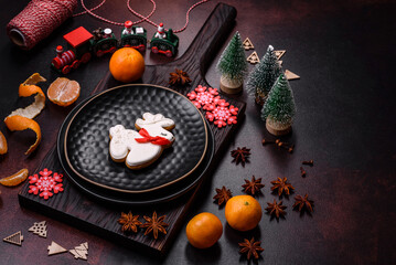 Beautiful Christmas decorations with holiday toys, clementines and gingerbread