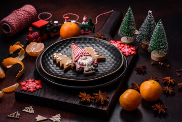 Beautiful Christmas decorations with holiday toys, clementines and gingerbread