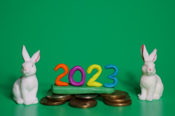 Calendar date 2023 and toy rabbits.