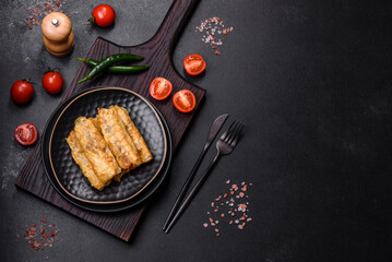 Fresh bite rolls from leaves of cabbage with minced meat, onions and carrots