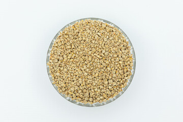 Fraction of feed additives for animals on a white background in a bowl