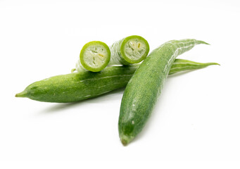 Snake gourd slices isolated on white background