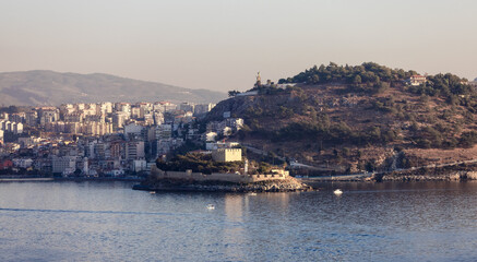 Fototapeta premium Homes and Buildings in a Touristic Town by the Aegean Sea. Kusadasi, Turkey. Sunny Evening.
