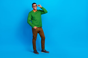 Full length photo of young funny positive confident business man wer classic outfit glasses promo company vacancy isolated on blue color background