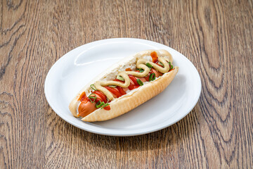 hot dog with mustard ketchup and spring onion