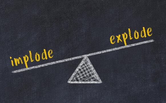 Chalk drawing of scales with words implode and explode. Concept of balance