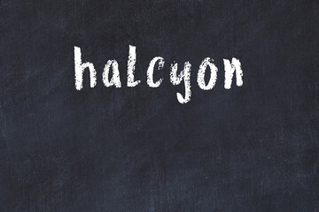 Black chalkboard with inscription halcyon on in - obrazy, fototapety, plakaty